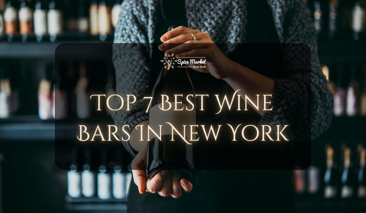 Top 7 Best Wine Bars In New York - a bartender holding a nice bottle of wine in a bar